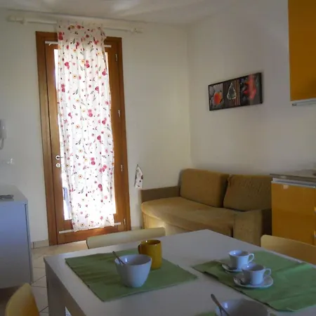 Colorful With Fenced Garden And Fireplace Bibione