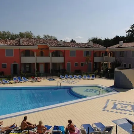 Colorful With Fenced Garden And Fireplace Bibione